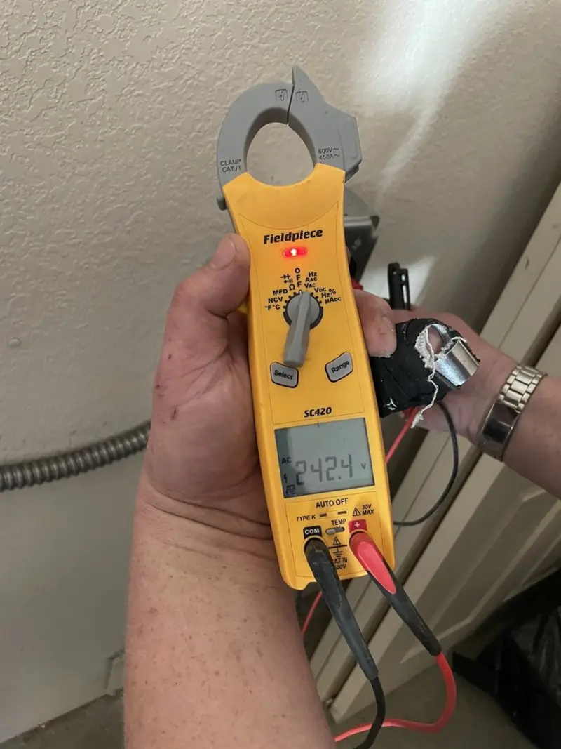 Voltage testing with clamp meter during Whole House Surge Protector in Monson